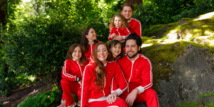 Image shows the Bitchin' Sauce owners and their children wearing red Bitchin' Sauce tracksuits
