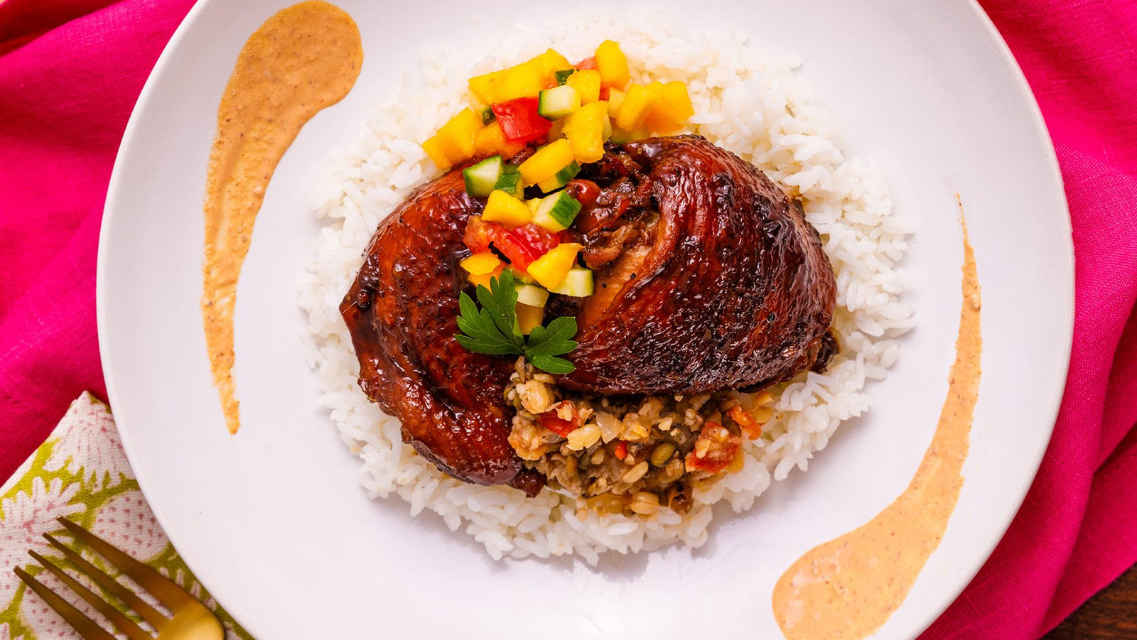 Chicken rice bowl with mango salsa and a swoosh of Bitchin' Sauce as the rice bowl sauce